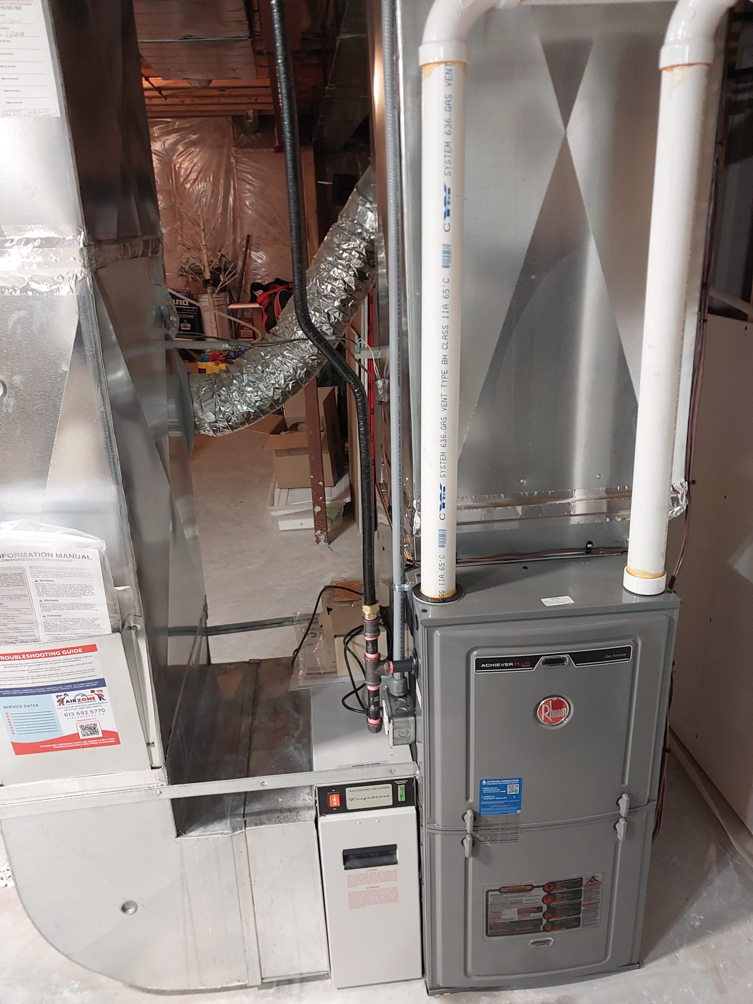 AirZone technician performing furnace maintenance in Kemptville.